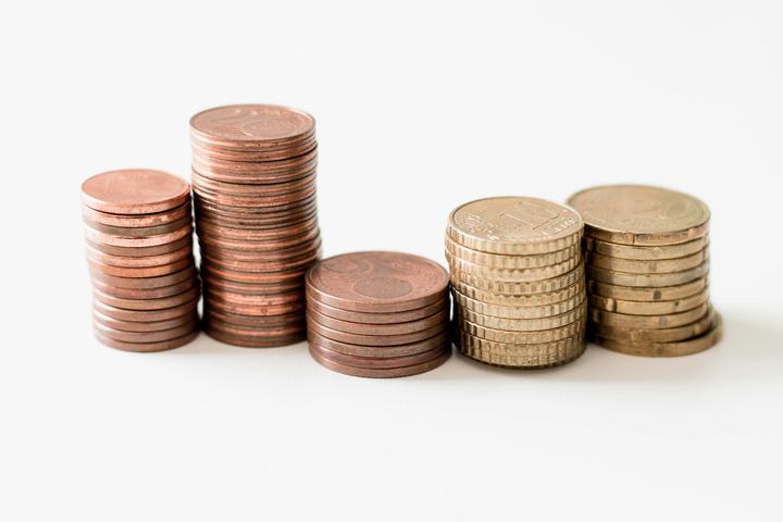 Stacks of coins representing the cost of business funding