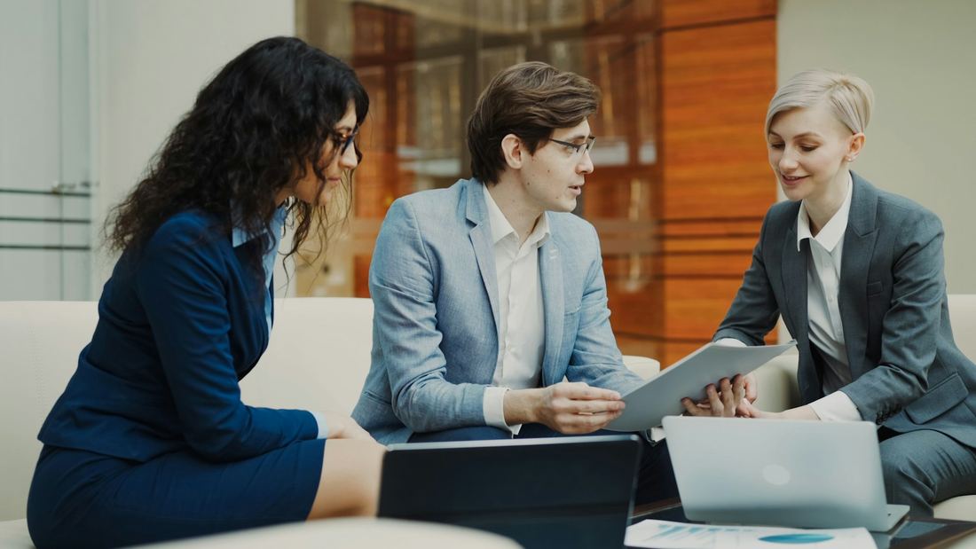 Referral partners reviewing documents with an Sterling Advance advisor